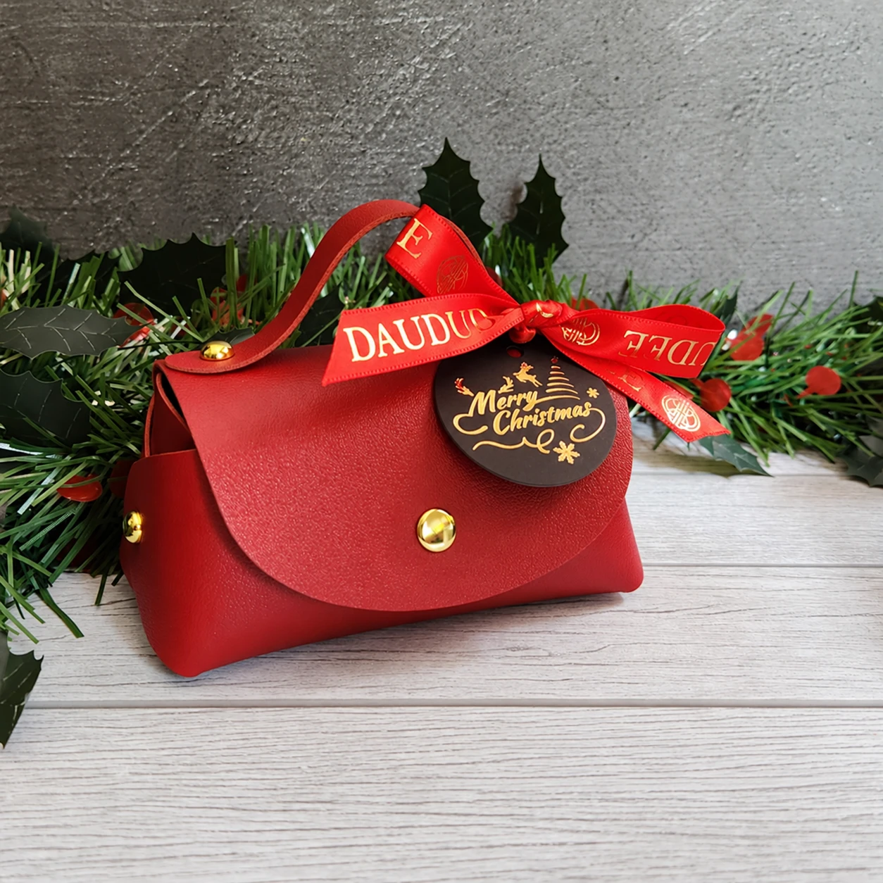 Mini red gift bag with Christmas ribbon and tag