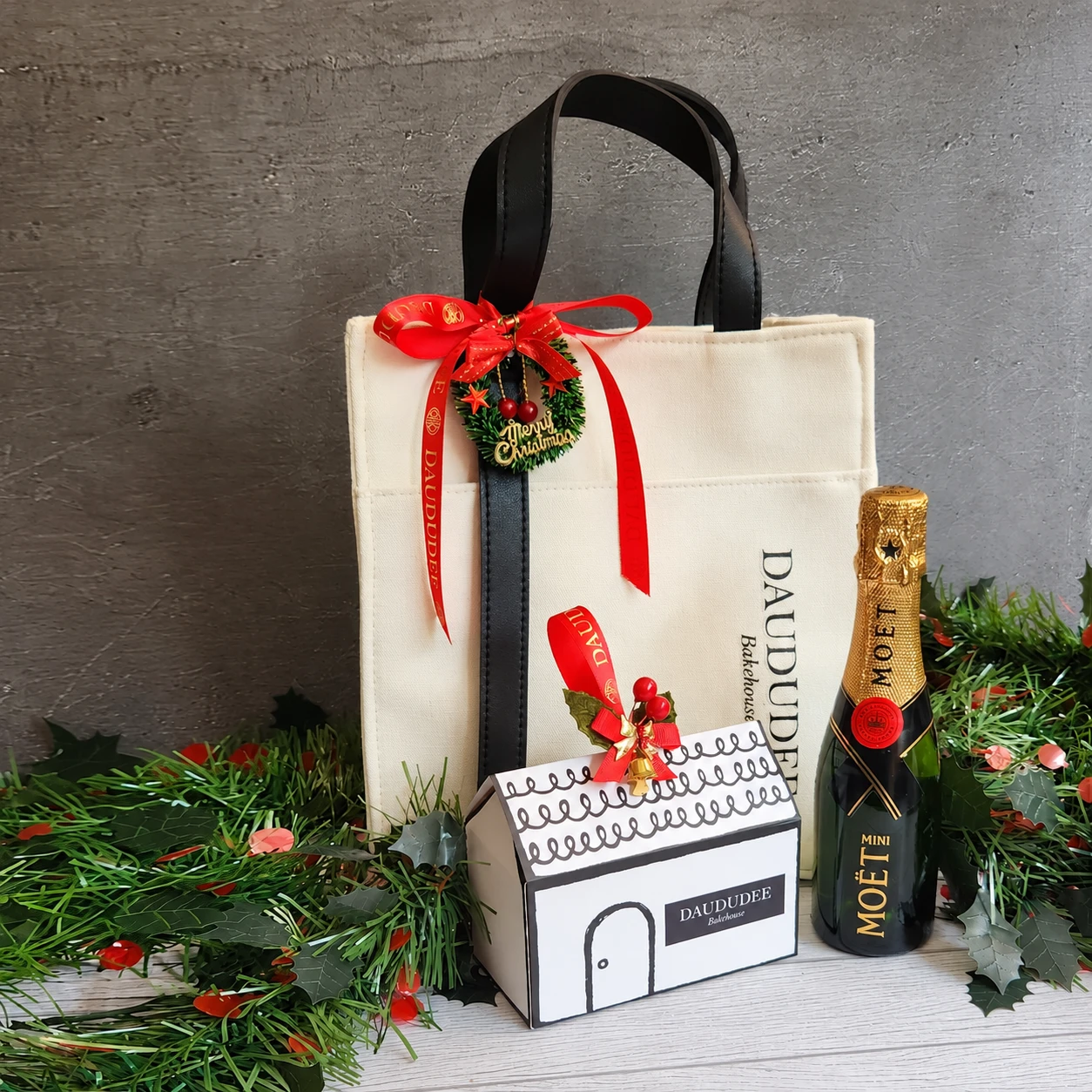 Canvas Christmas gift bag with a house cookie box and mini champagne
