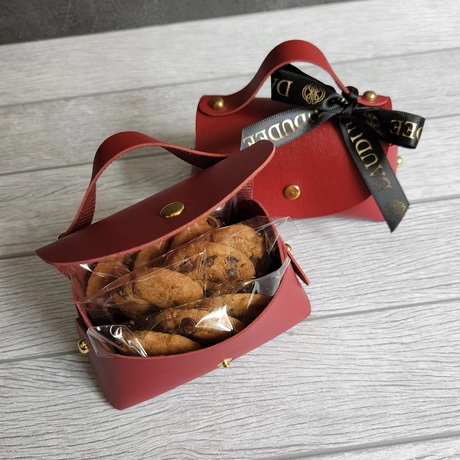 Mini red gift bags with individually wrapped cookies