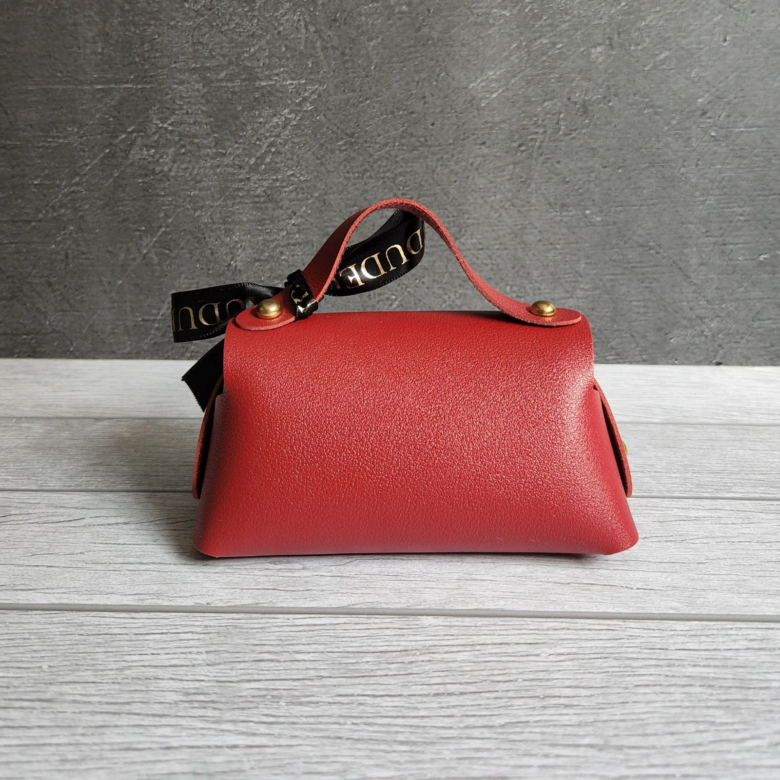 The back of our keepsake mini red bag