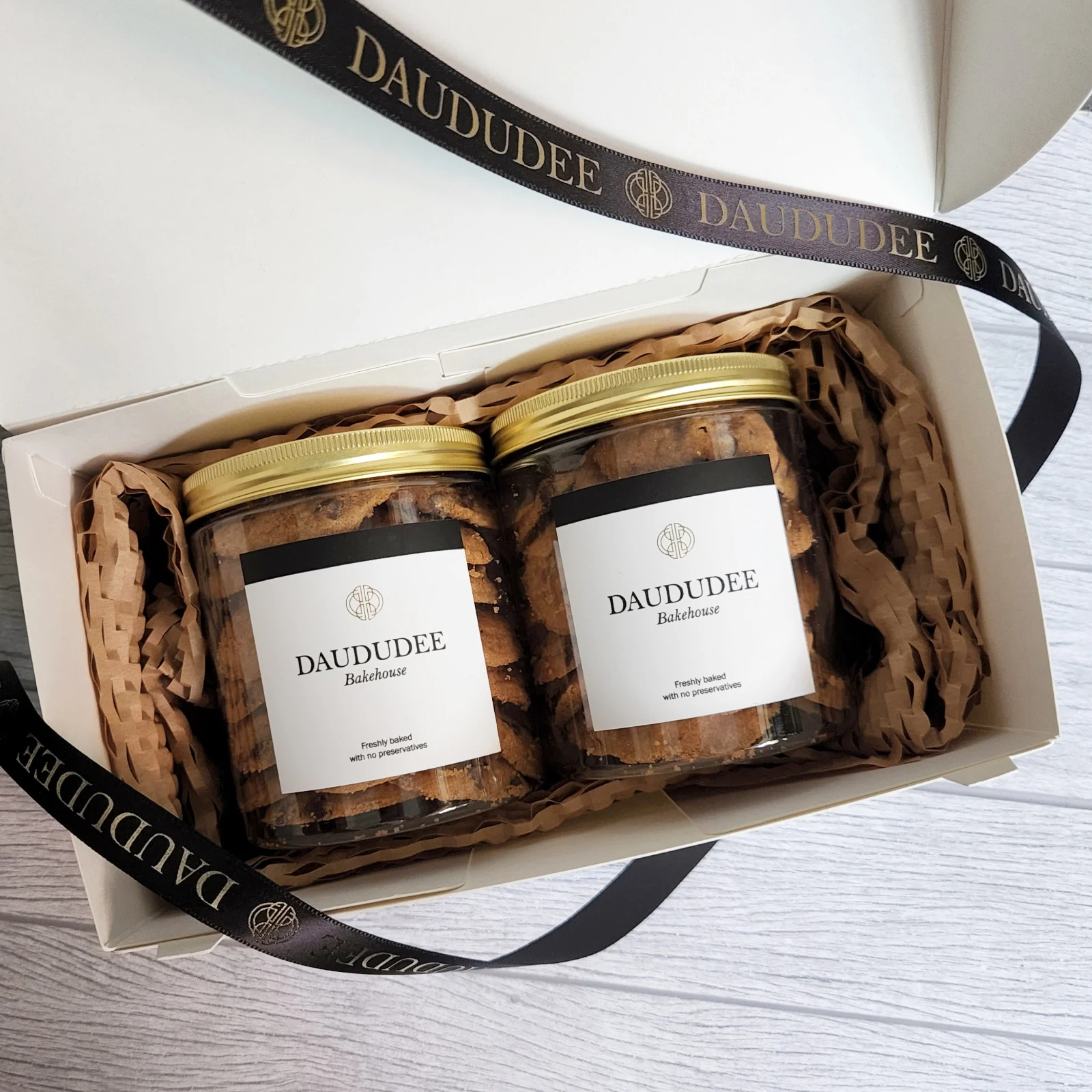 Two cookie jars nestled in a gift box
