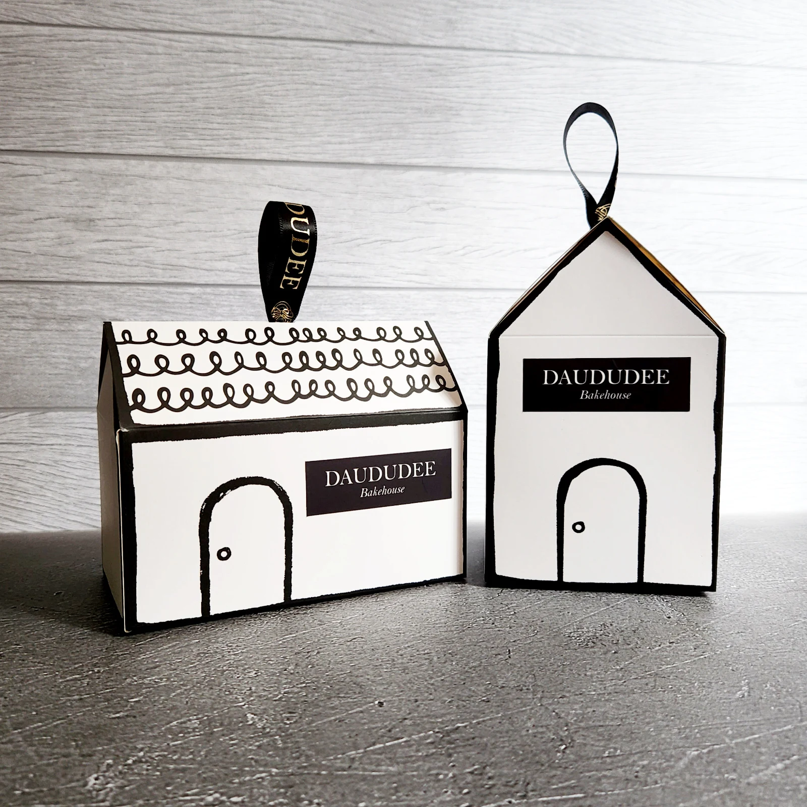 Tall and short house-shaped cookie boxes