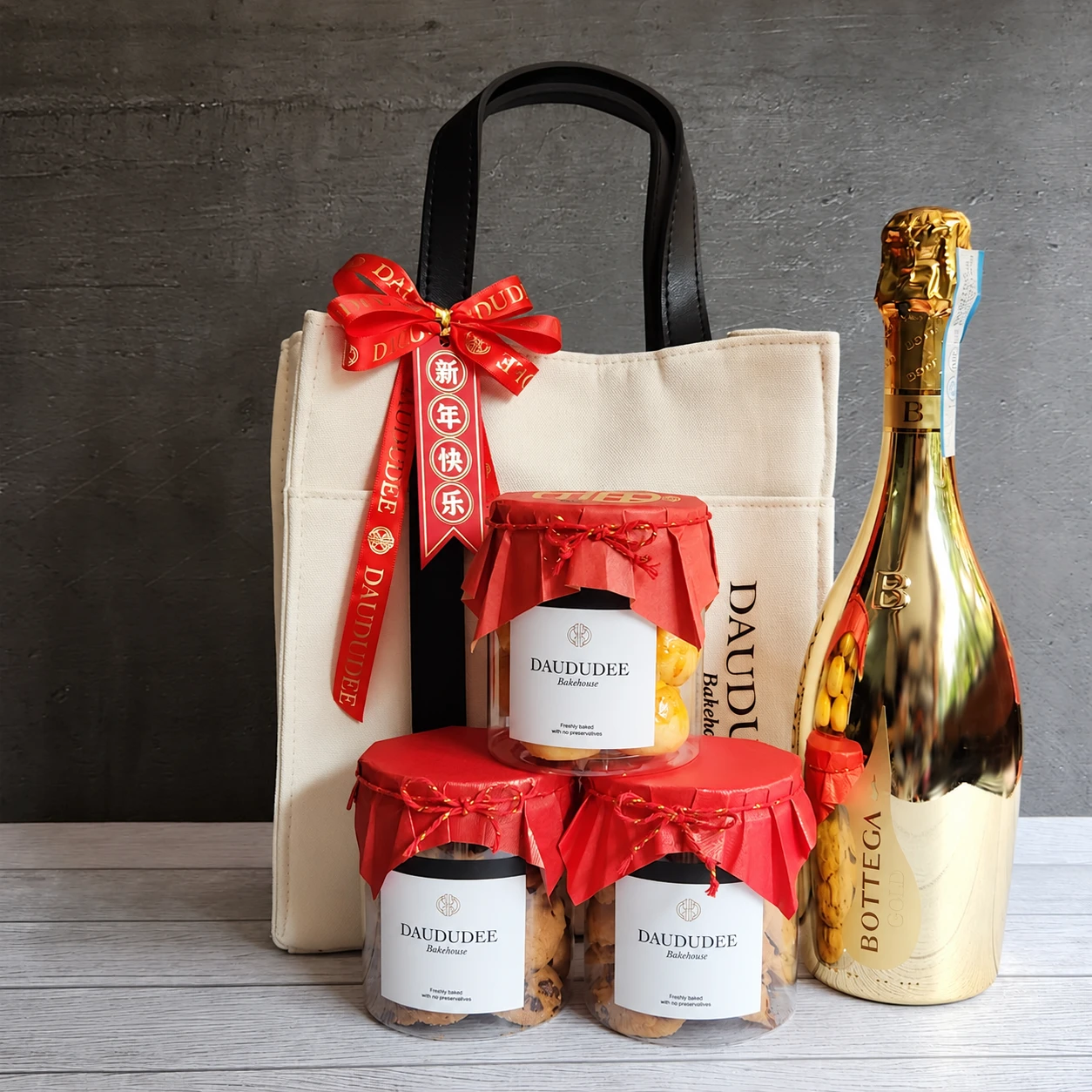 Lunar New Year canvas gift bag with three cookie jars and a gold bottle