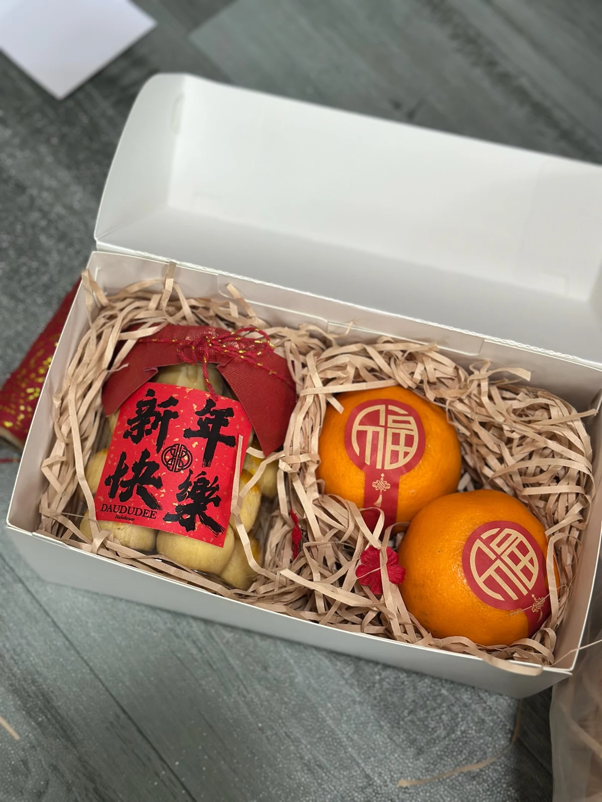 Pineapple tart jar and mandarins in a Lunar New Year box