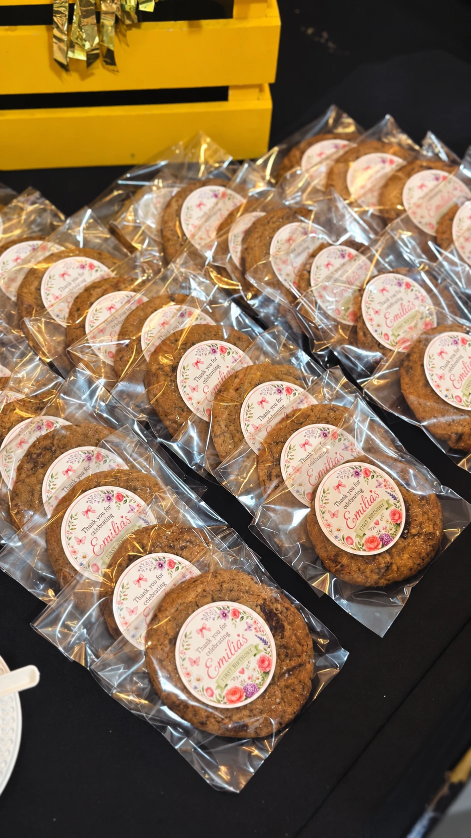 Individually wrapped birthday cookies with personalised floral labels