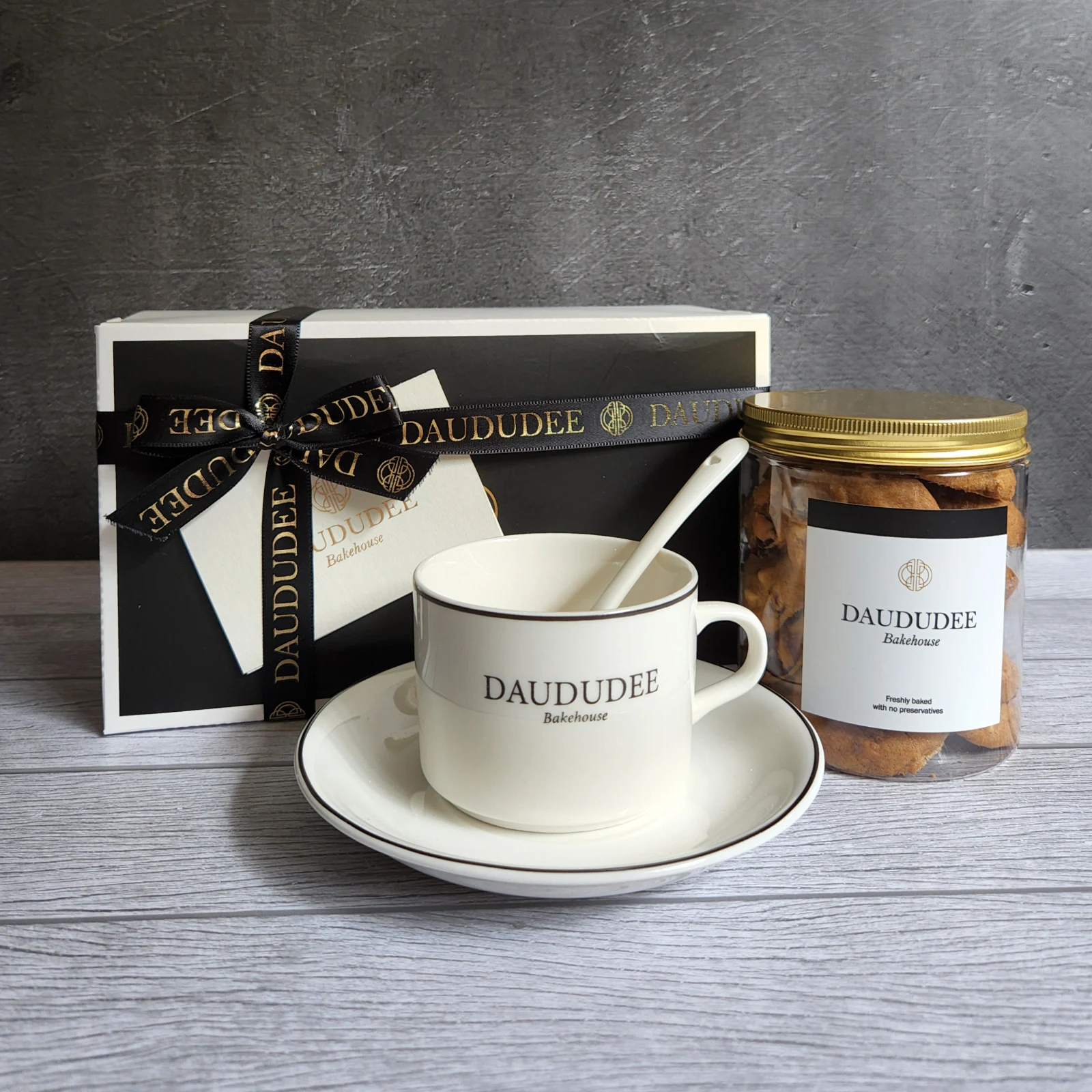 Cookie and teacup gift set with black and gold ribbon